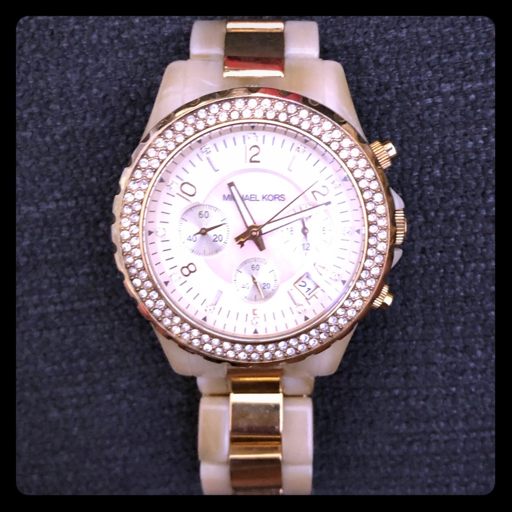 MK watch w yellow gold trim/ mother of pearl face.
